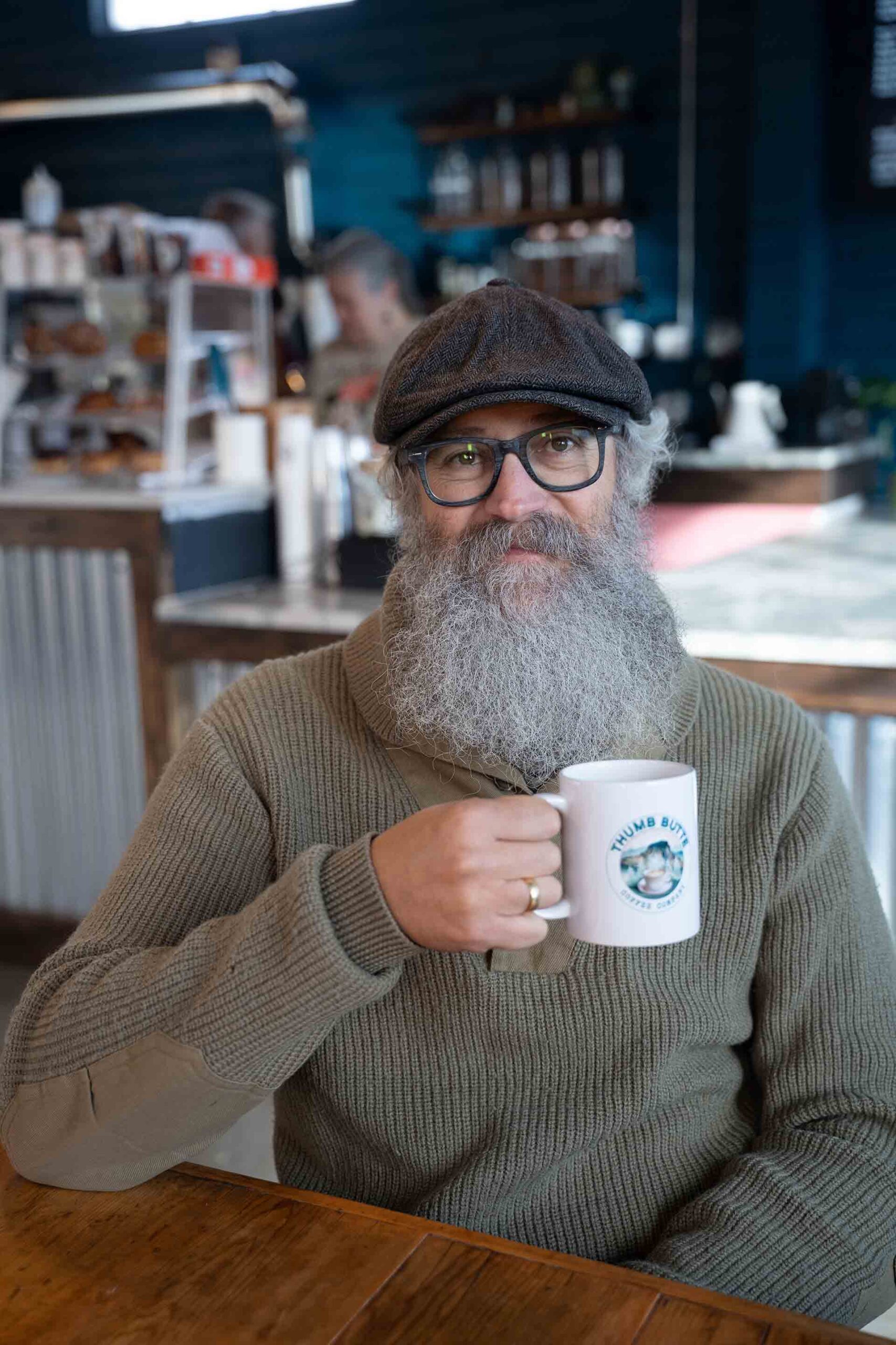 Coffee lover savoring brew in Prescott AZ café Man enjoying artisan coffee at Freedman’s Finest Coffee Prescott AZ