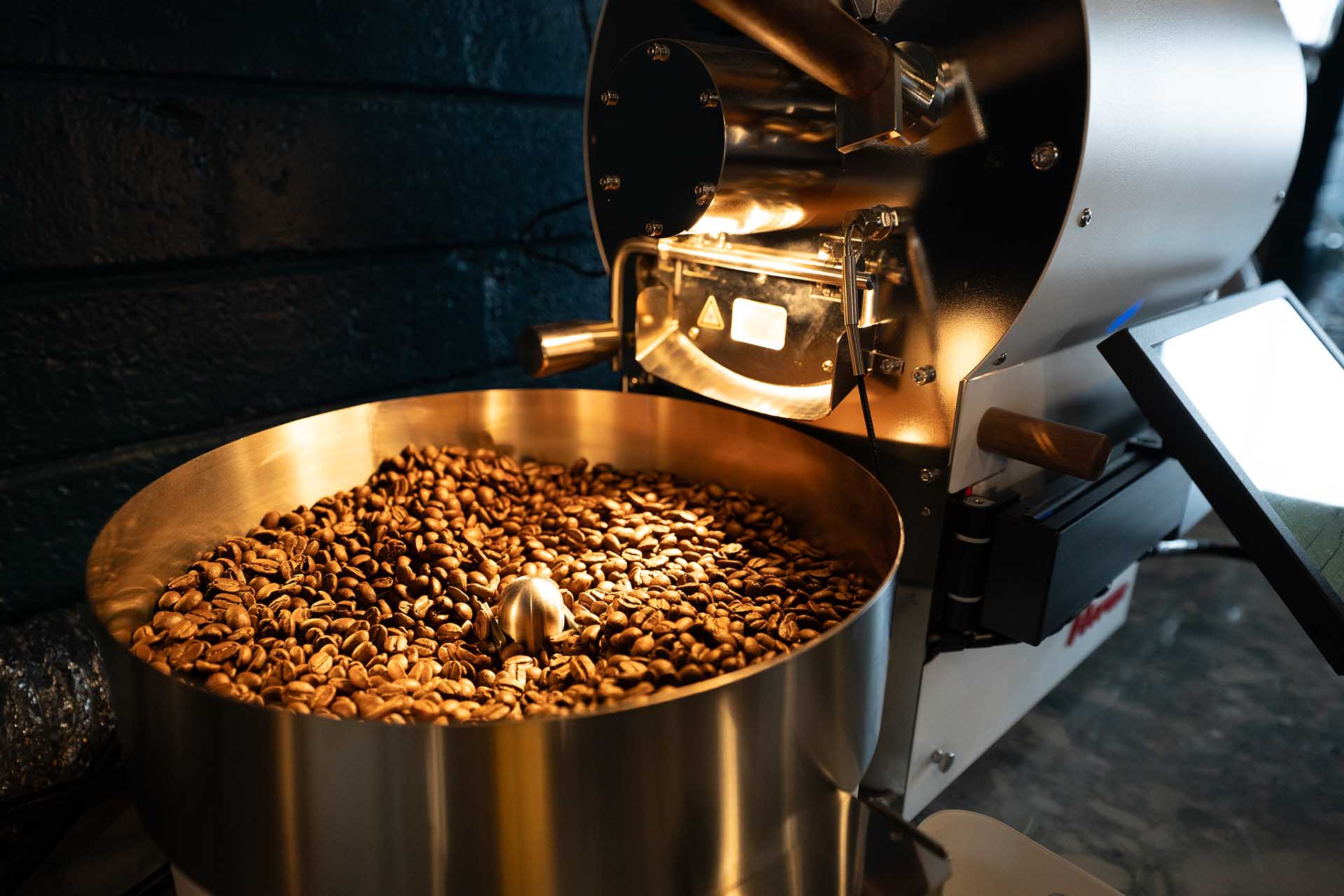 Premium beans roasting at local Prescott AZ coffee facility Front entrance of John Hancock Barber shop inside Founding Fathers Collective in Prescott